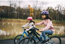 two girls riding on bikes